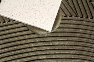 Ceramic tiles and tools for tiler. Floor tiles installation. Home improvement, renovation - ceramic