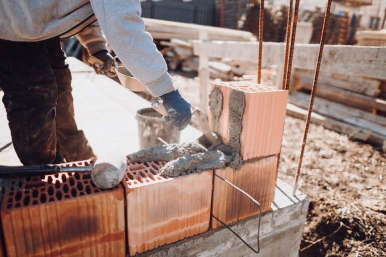 construction industry details - worker bricklayer building exterior walls