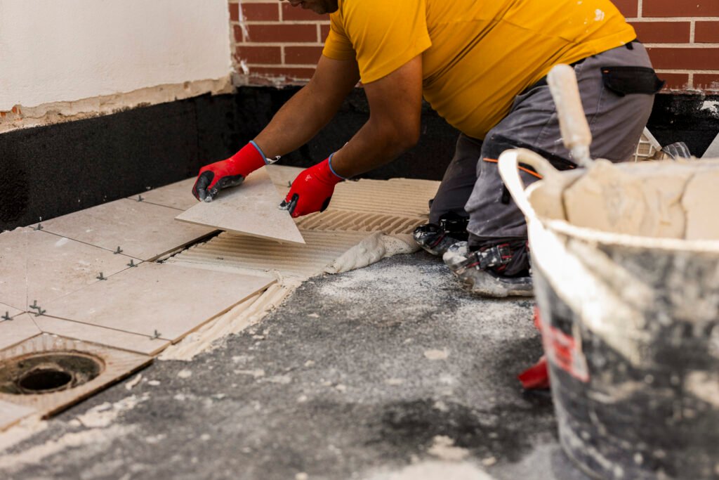 midsection, hispanic, man, laying, tile, floor, new house, adults only, renovation, bathroom, aluminum, apartment, adult, blue-collar worker, building contractor, bangkok, building - activity, architecture, repairman, indoor, installing, horizontal, ceramic, working, home improvement, construction worker, occupation, house, person, one person, color image, industry, male, diy, cement, tiled floor, repairing, hand, new, concrete, construction site, craftsperson, professional occupation, work tool, material, glue, trowel, residential building, human body part, decoration