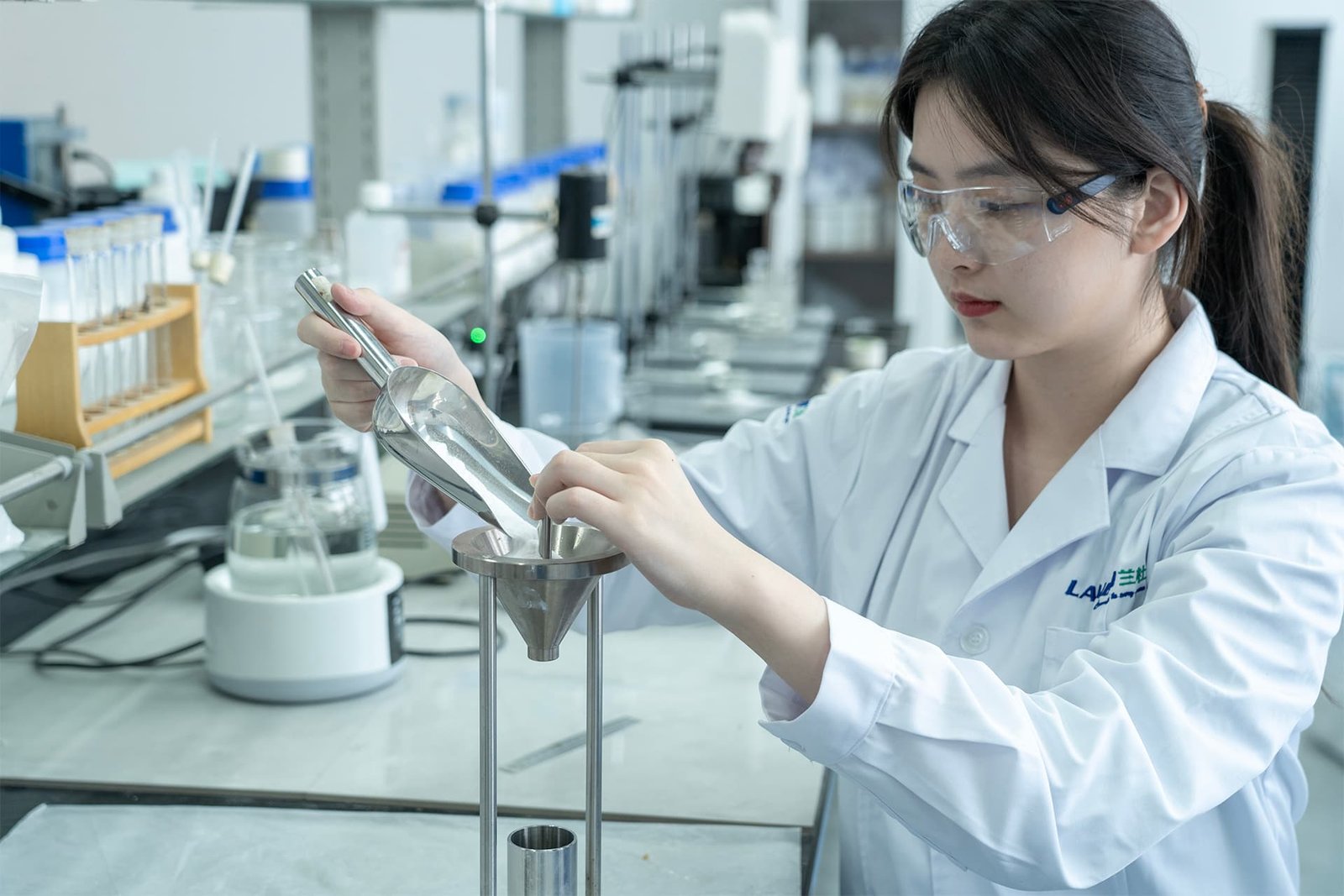 LANDU laboratory technician testing construction additive performance
